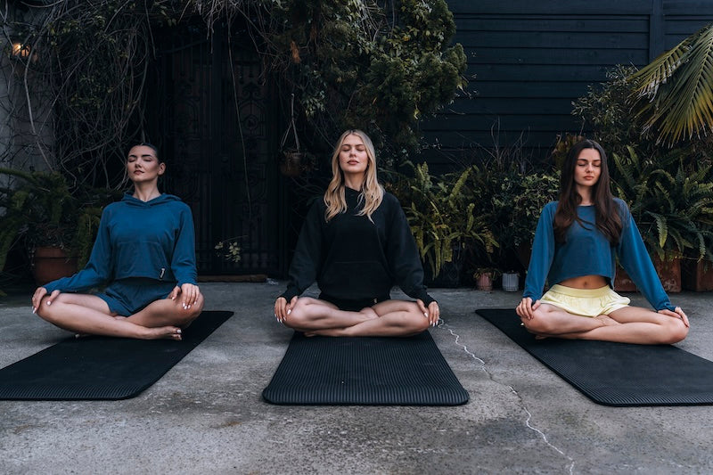 (Left) Flow hoodie, canyon everyday run short, (middle) aligned pullover hoodie, monte vista body short, (right) flow crew, canyon everyday run short